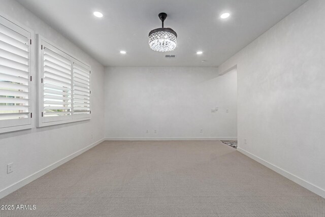1501 E Rakestraw Ln, Gilbert, AZ 85298 - empty room with recessed lighting, light carpet, a chandelier, and baseboards