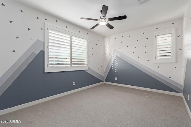 1501 E Rakestraw Ln, Gilbert, AZ 85298 - spare room featuring a ceiling fan, plenty of natural light, baseboards, and carpet floors