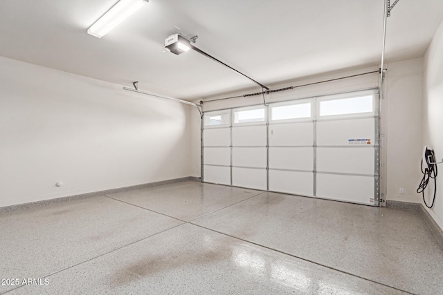1501 E Rakestraw Ln, Gilbert, AZ 85298 - garage featuring a garage door opener and baseboards