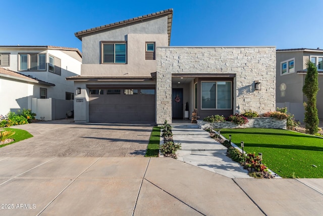 1501 E Rakestraw Ln, Gilbert, AZ 85298 - view of front facade with driveway, a garage, stucco siding, and stone siding
