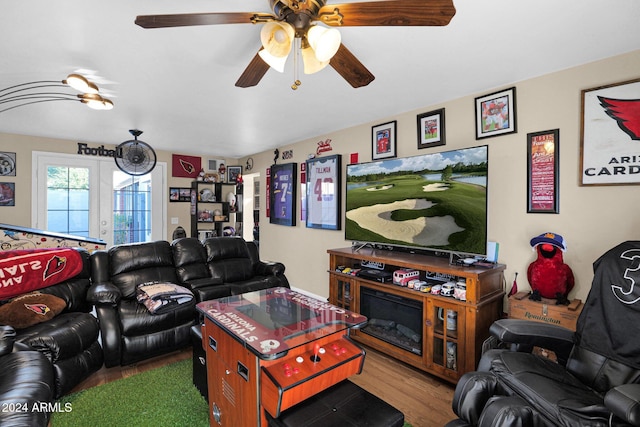 living room with ceiling fan, french doors, and hardwood / wood-style flooring