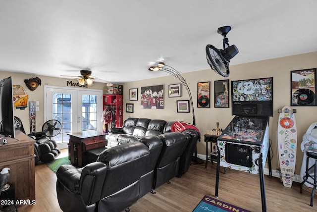 living room featuring ceiling fan, french doors, and light wood-type flooring