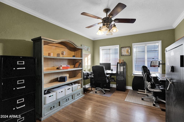 office area featuring hardwood / wood-style flooring, ceiling fan, ornamental molding, and a textured ceiling