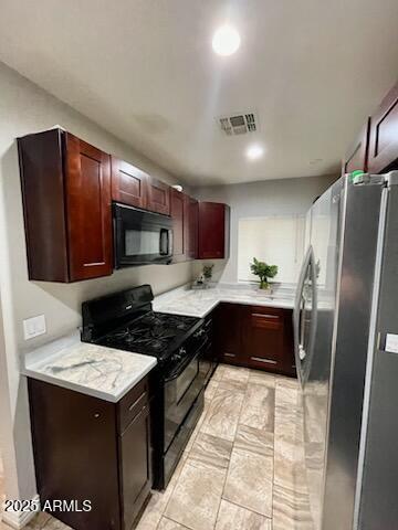 kitchen with dark brown cabinets, visible vents, recessed lighting, light countertops, and black appliances