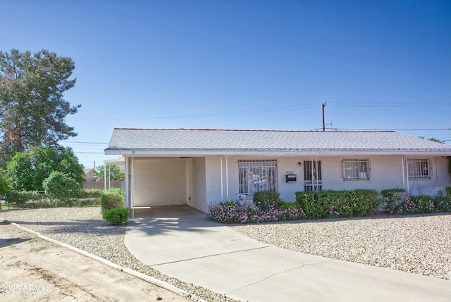 single story home featuring a carport