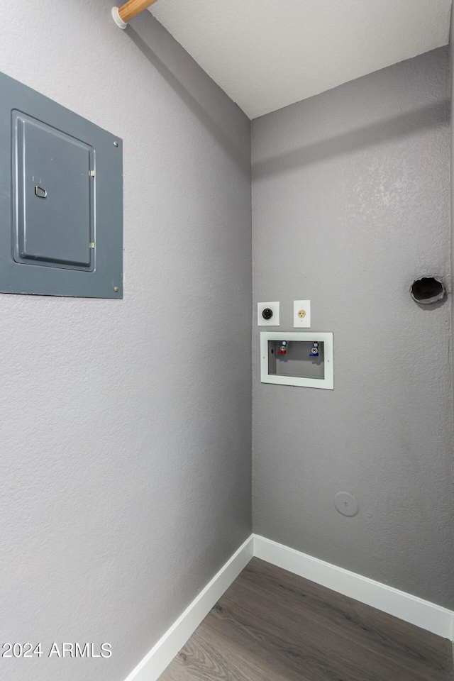 laundry area featuring baseboards, dark wood finished floors, washer hookup, laundry area, and electric dryer hookup