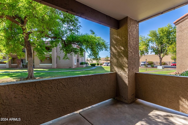 view of patio with a residential view and a balcony