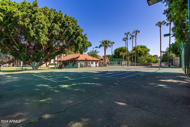 view of sport court with fence