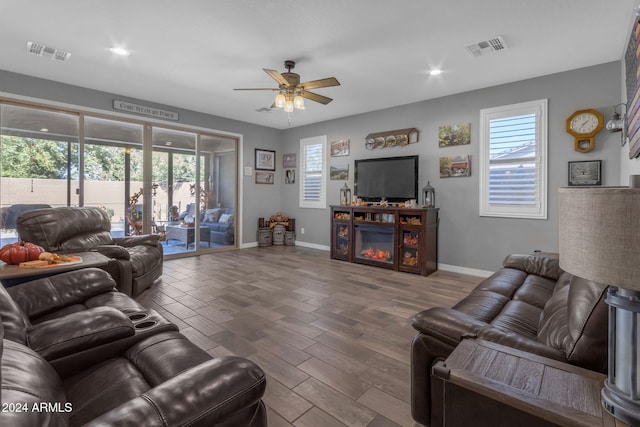 living room featuring hardwood / wood-style flooring and ceiling fan