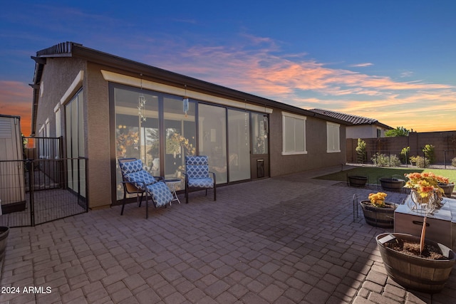 patio terrace at dusk with a fire pit