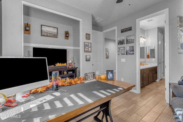 interior space featuring dark brown cabinetry and ceiling fan