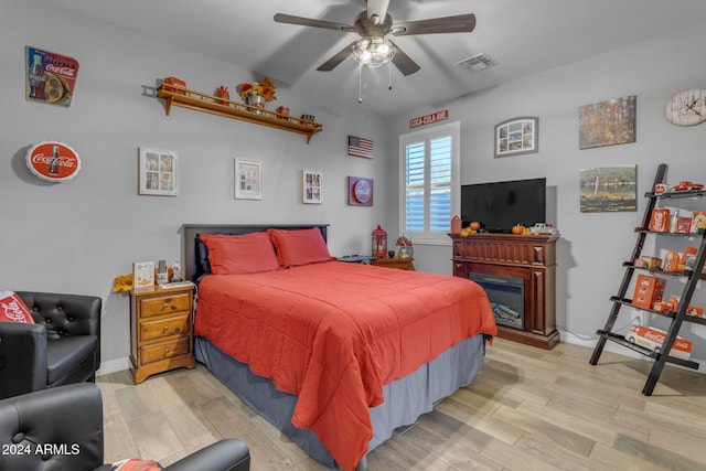 bedroom featuring light hardwood / wood-style flooring and ceiling fan