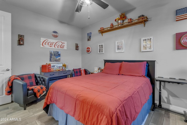 bedroom with light wood-type flooring and ceiling fan