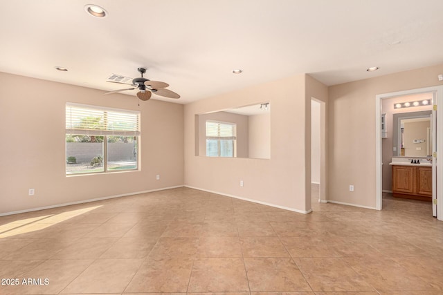 spare room with a wealth of natural light, visible vents, baseboards, and recessed lighting