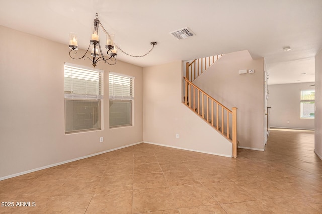 unfurnished room with visible vents, a notable chandelier, stairway, light tile patterned floors, and baseboards