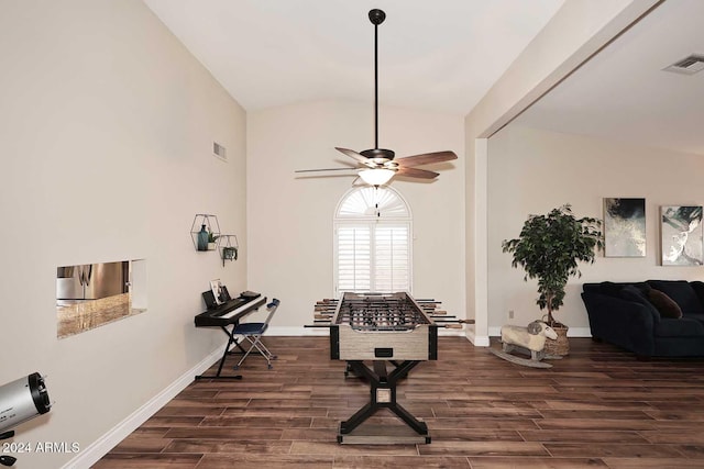 miscellaneous room with dark hardwood / wood-style flooring, ceiling fan, and vaulted ceiling