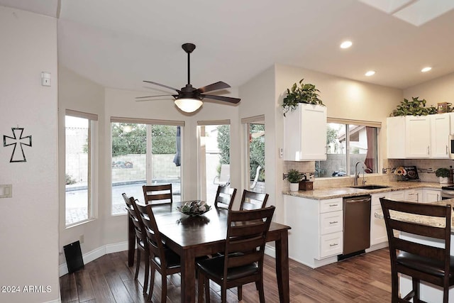 dining area with dark hardwood / wood-style flooring, ceiling fan, sink, and a healthy amount of sunlight