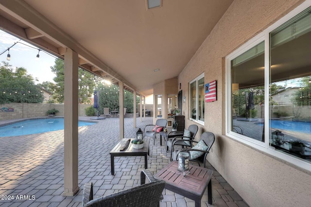 view of patio featuring a fenced in pool