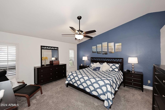 bedroom with lofted ceiling, ceiling fan, and carpet floors