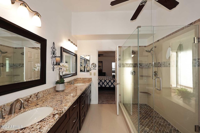 bathroom featuring an enclosed shower, vanity, and tile patterned floors