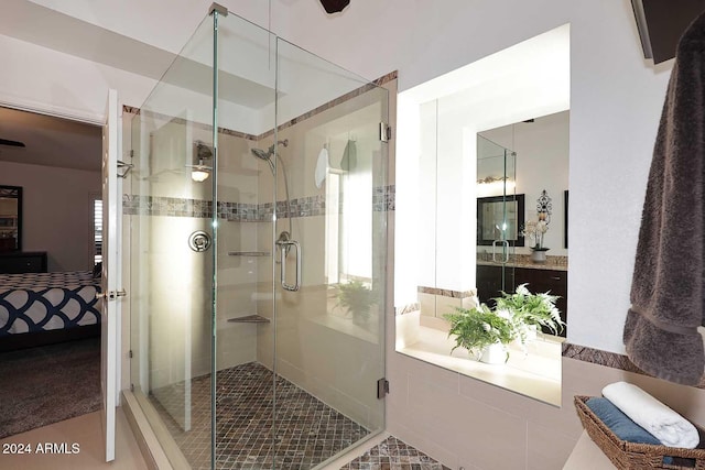 bathroom with walk in shower and tile patterned floors