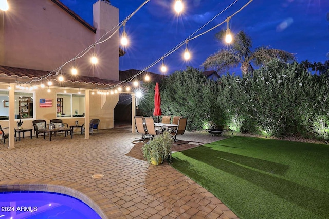 patio at twilight with a lawn