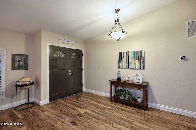 foyer entrance with dark hardwood / wood-style flooring