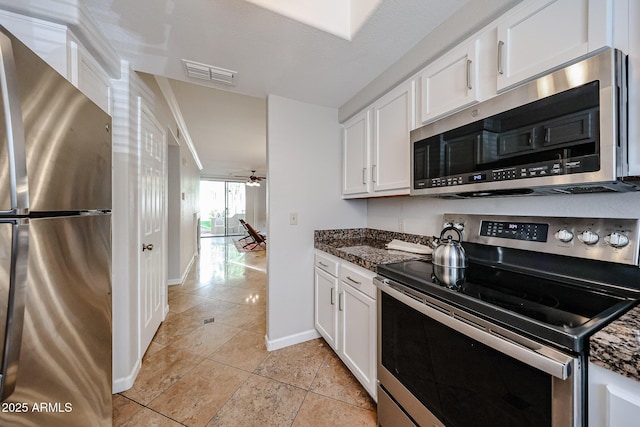 kitchen featuring visible vents, white cabinets, baseboards, ceiling fan, and appliances with stainless steel finishes