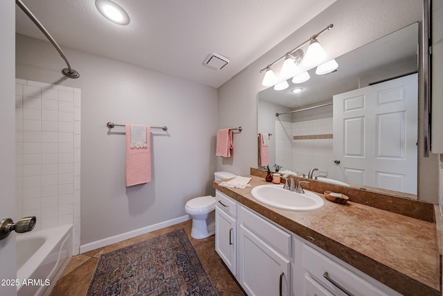 full bath featuring toilet, visible vents, bathing tub / shower combination, vanity, and baseboards