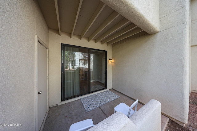 doorway to property with stucco siding