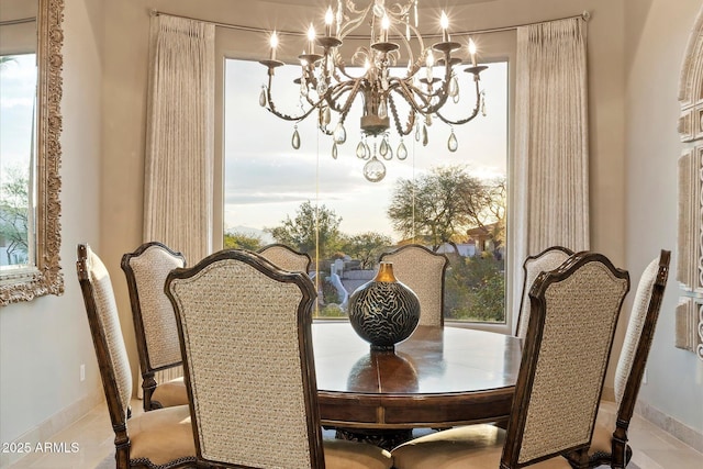 6621 N Arizona Biltmore Cir, Phoenix, AZ 85016 - dining area with a chandelier and baseboards