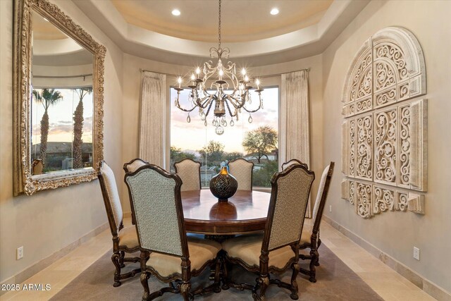 6621 N Arizona Biltmore Cir, Phoenix, AZ 85016 - tiled dining area featuring a chandelier, a raised ceiling, recessed lighting, and baseboards