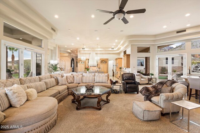 6621 N Arizona Biltmore Cir, Phoenix, AZ 85016 - living area featuring arched walkways, a ceiling fan, recessed lighting, and a high ceiling