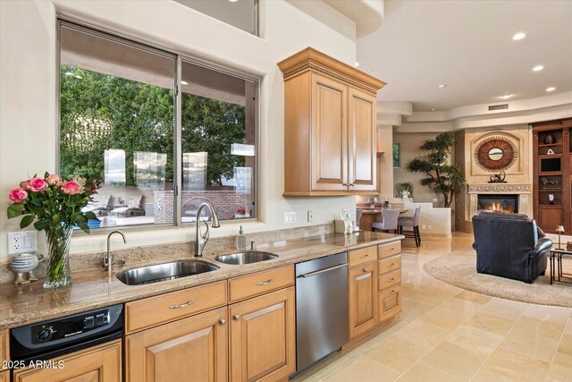 6621 N Arizona Biltmore Cir, Phoenix, AZ 85016 - kitchen with dishwasher, light stone counters, open floor plan, a fireplace, and recessed lighting
