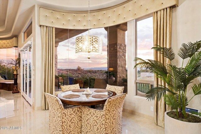 6621 N Arizona Biltmore Cir, Phoenix, AZ 85016 - dining space featuring a chandelier, baseboards, and french doors