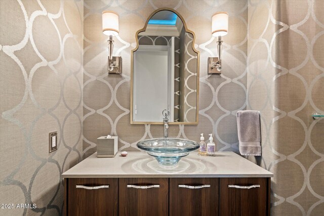 6621 N Arizona Biltmore Cir, Phoenix, AZ 85016 - bathroom featuring vanity and wallpapered walls