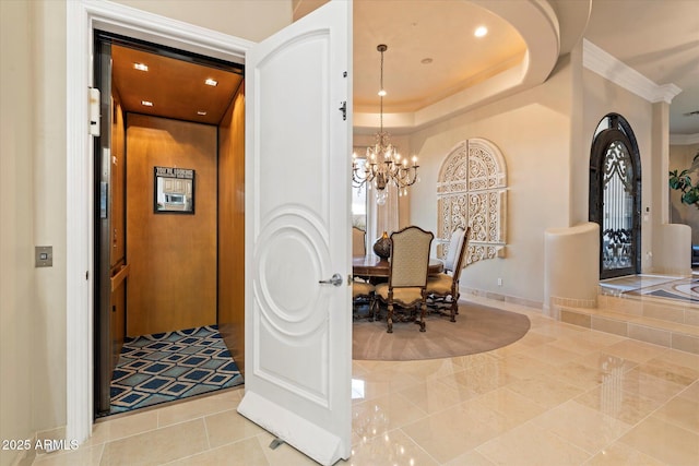 6621 N Arizona Biltmore Cir, Phoenix, AZ 85016 - hallway featuring elevator, ornamental molding, tile patterned flooring, a chandelier, and baseboards