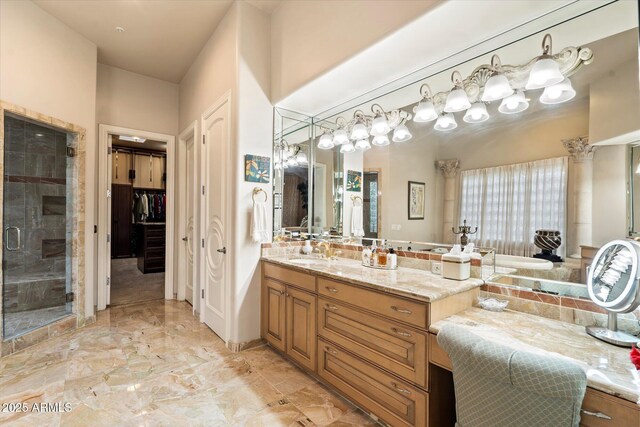 6621 N Arizona Biltmore Cir, Phoenix, AZ 85016 - full bathroom with a shower stall, vanity, marble finish floors, and a walk in closet