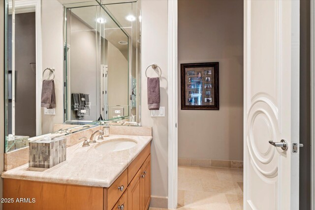 6621 N Arizona Biltmore Cir, Phoenix, AZ 85016 - bathroom featuring baseboards, vanity, and tile patterned flooring