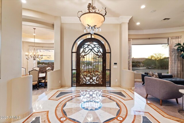 6621 N Arizona Biltmore Cir, Phoenix, AZ 85016 - foyer featuring inlaid floor details, a chandelier, ornamental molding, recessed lighting, and marble tiled floors
