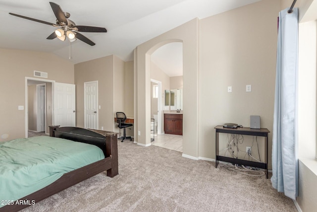 3424 E Harmony Ave, Mesa, AZ 85204 - bedroom with vaulted ceiling, carpet floors, arched walkways, baseboards, and ensuite bath