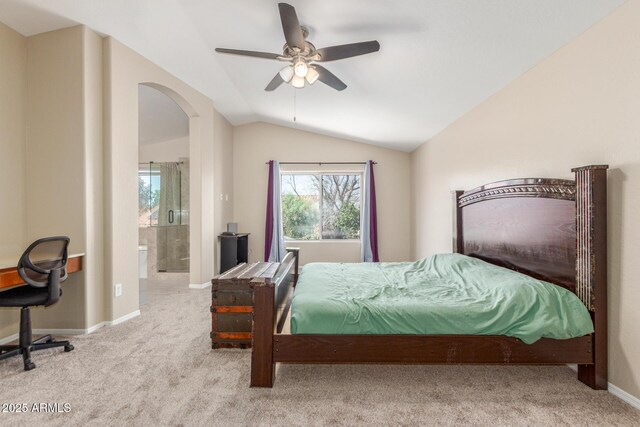 3424 E Harmony Ave, Mesa, AZ 85204 - carpeted bedroom with lofted ceiling, arched walkways, connected bathroom, baseboards, and a ceiling fan