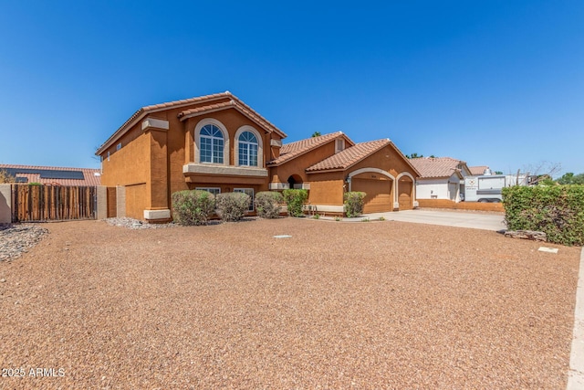3424 E Harmony Ave, Mesa, AZ 85204 - mediterranean / spanish-style house with concrete driveway, a garage, stucco siding, and a tile roof