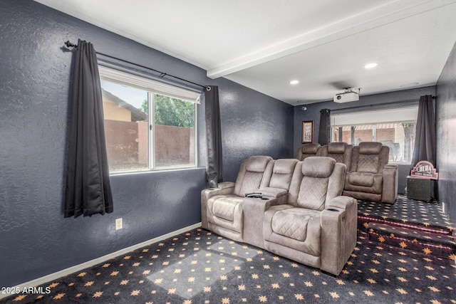 3424 E Harmony Ave, Mesa, AZ 85204 - cinema room featuring carpet floors, baseboards, a textured wall, and beam ceiling
