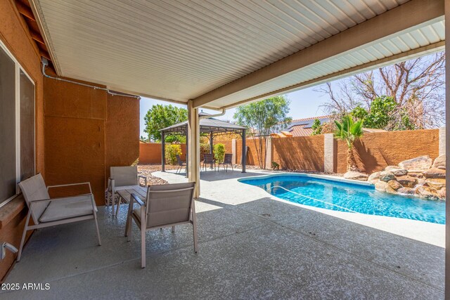 3424 E Harmony Ave, Mesa, AZ 85204 - view of swimming pool with a gazebo, a patio area, and a fenced backyard
