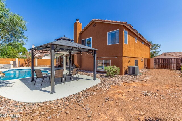 3424 E Harmony Ave, Mesa, AZ 85204 - rear view of property featuring a gazebo, a fenced backyard, stucco siding, a patio, and cooling unit