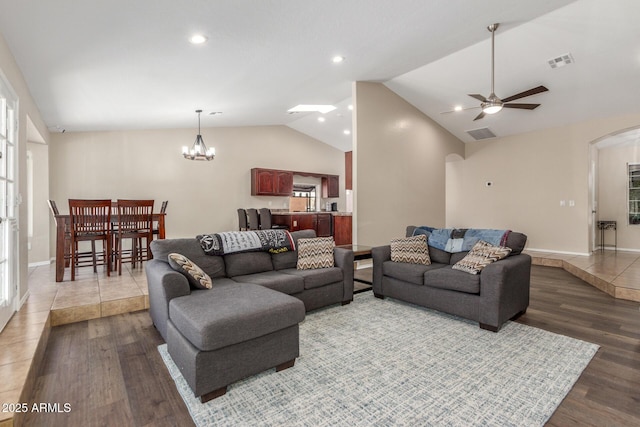 3424 E Harmony Ave, Mesa, AZ 85204 - living area with arched walkways, vaulted ceiling, ceiling fan, wood finished floors, and a chandelier