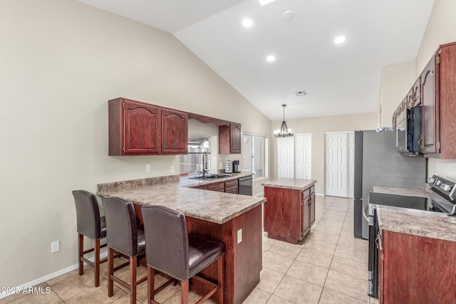 3424 E Harmony Ave, Mesa, AZ 85204 - kitchen featuring appliances with stainless steel finishes, a center island, a sink, a breakfast bar, and a peninsula