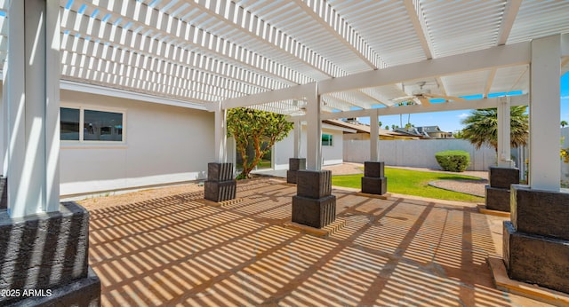 view of patio / terrace with fence, a ceiling fan, and a pergola