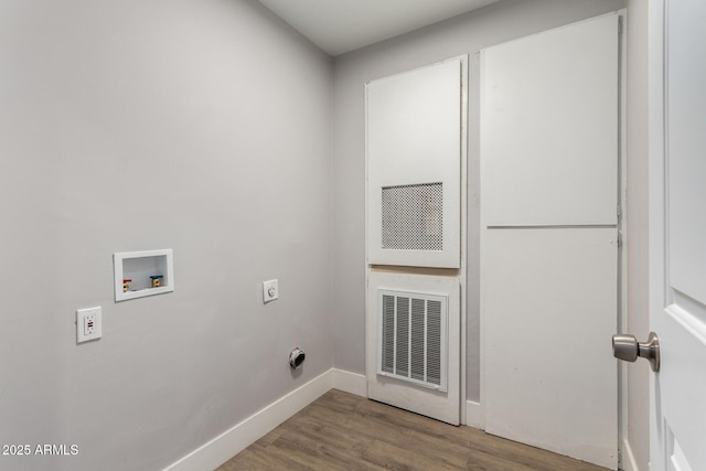 clothes washing area with laundry area, washer hookup, wood finished floors, visible vents, and electric dryer hookup